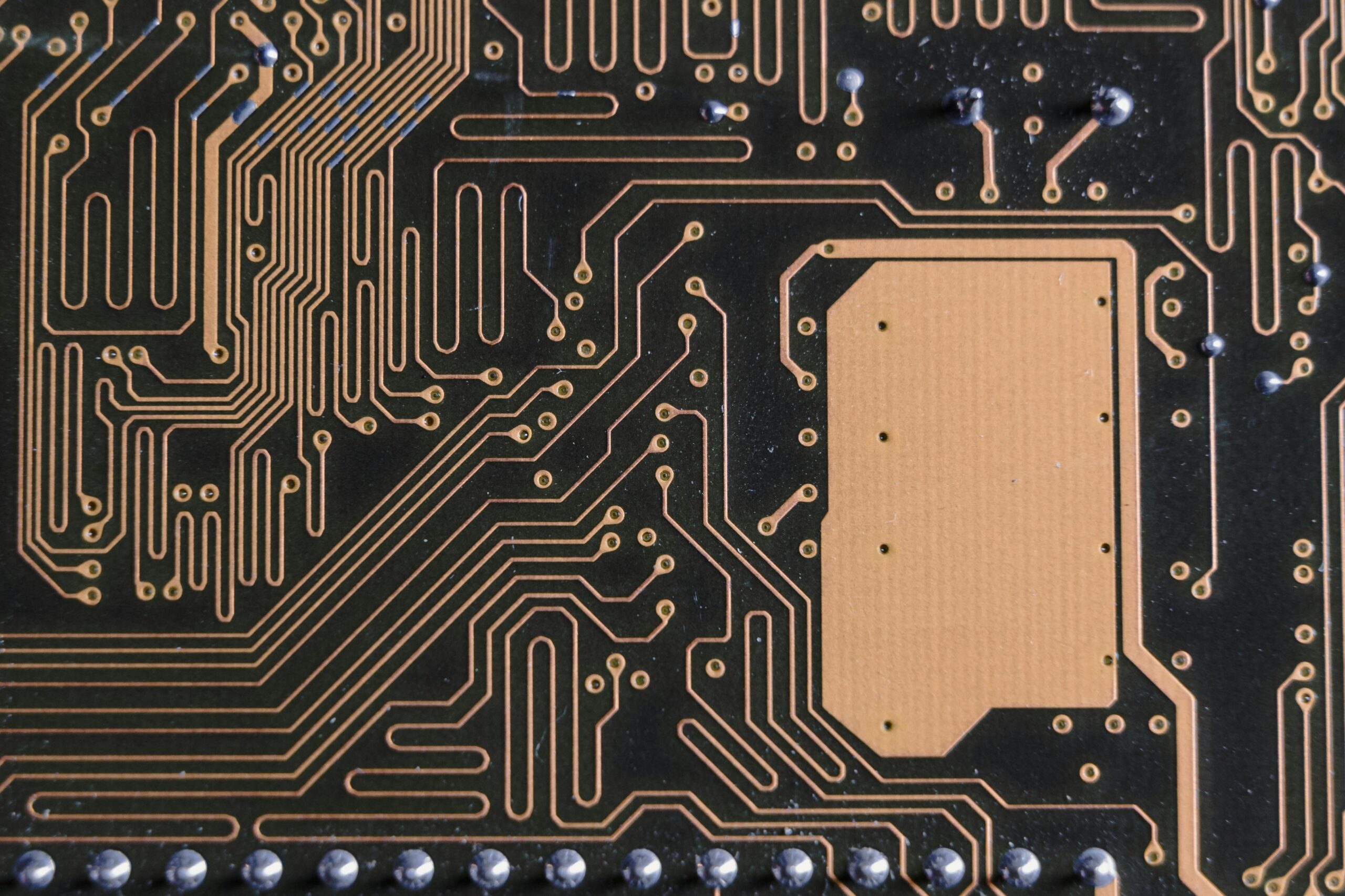 Detailed view of intricate circuit board patterns in technology hardware.